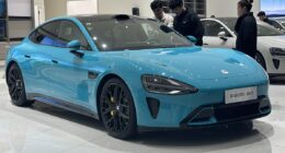 a blue sports car in a showroom